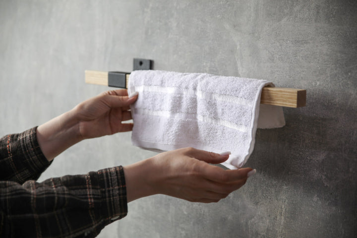 elegant-storage-solution-with-a-wooden-rail-perfect-for-towels