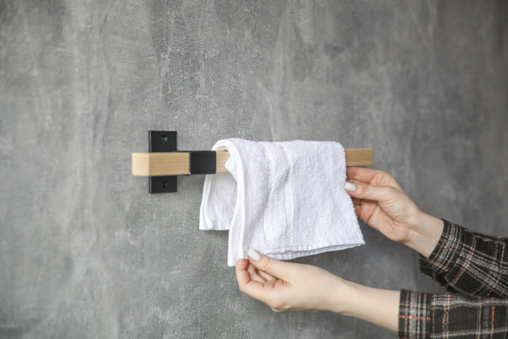 elegant-storage-solution-with-a-wooden-rail-perfect-for-towels