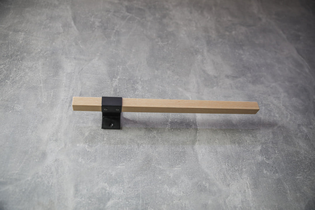 elegant-storage-solution-with-a-wooden-rail-perfect-for-towels