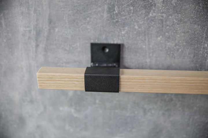 elegant-storage-solution-with-a-wooden-rail-perfect-for-towels