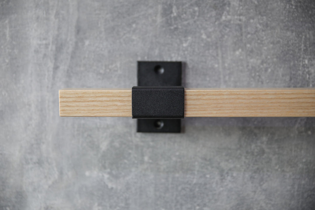 elegant-storage-solution-with-a-wooden-rail-perfect-for-towels