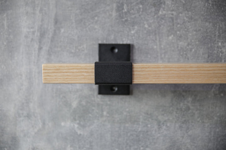 elegant-storage-solution-with-a-wooden-rail-perfect-for-towels