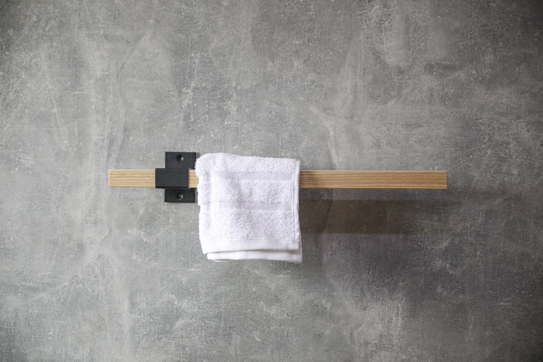 elegant-storage-solution-with-a-wooden-rail-perfect-for-towels