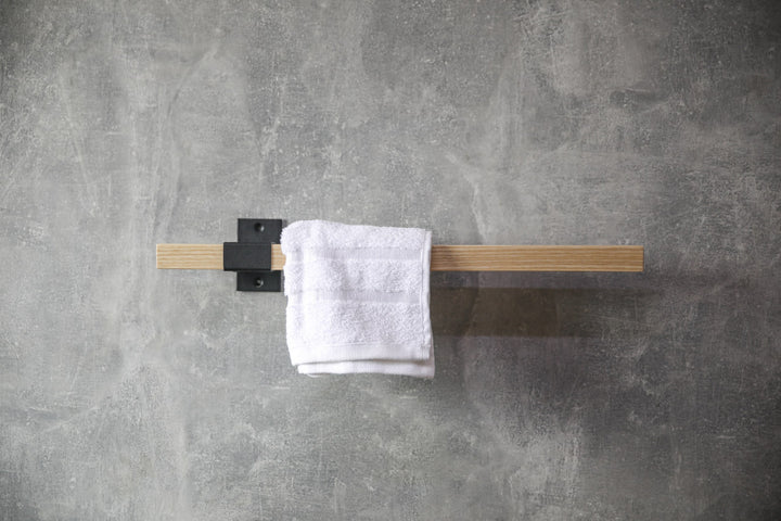 elegant-storage-solution-with-a-wooden-rail-perfect-for-towels