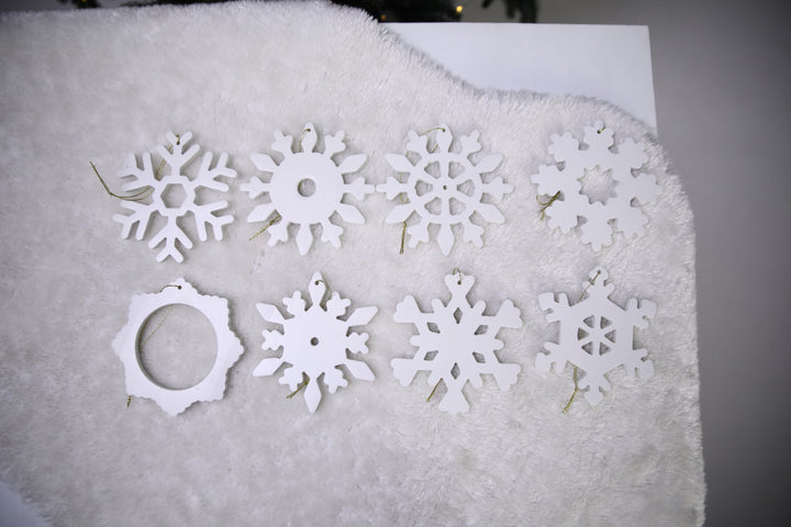 Hands-showing-white-plywood-snowflake-Christmas-decorations