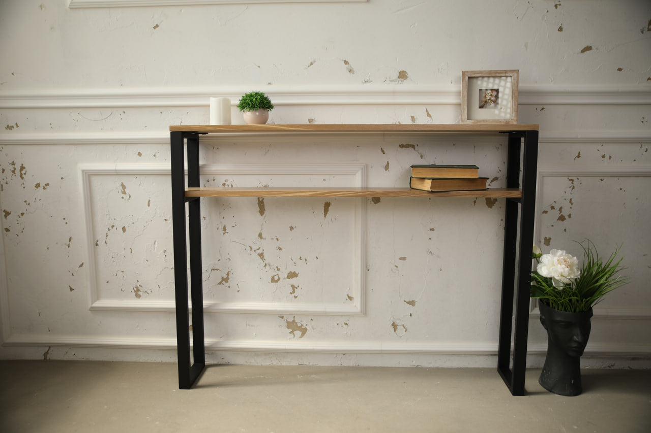 Slim-wood-and-metal-console-table-placed-along-a-hallway-wall