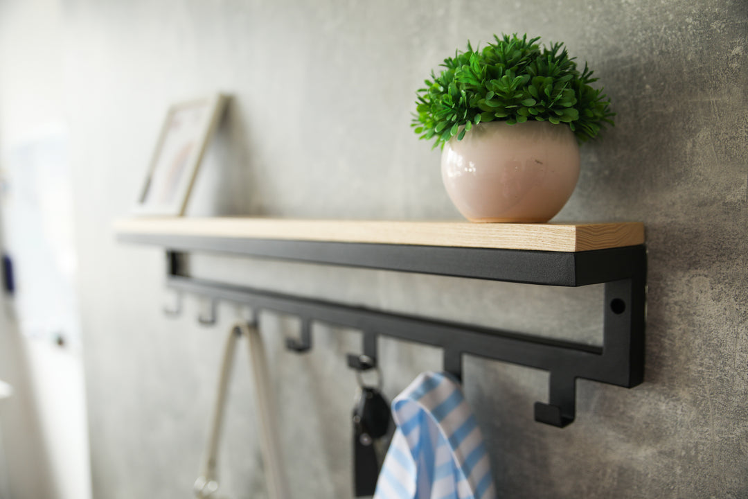 Entryway-wall-shelf-with-hooks-perfect-for-organizing-coats-bags-and-keys
