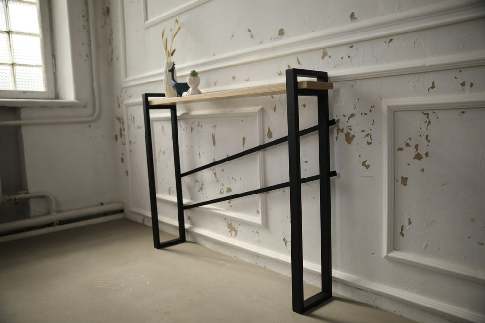 slim-wood-and-metal-console-table-placed-along-a-hallway-wall