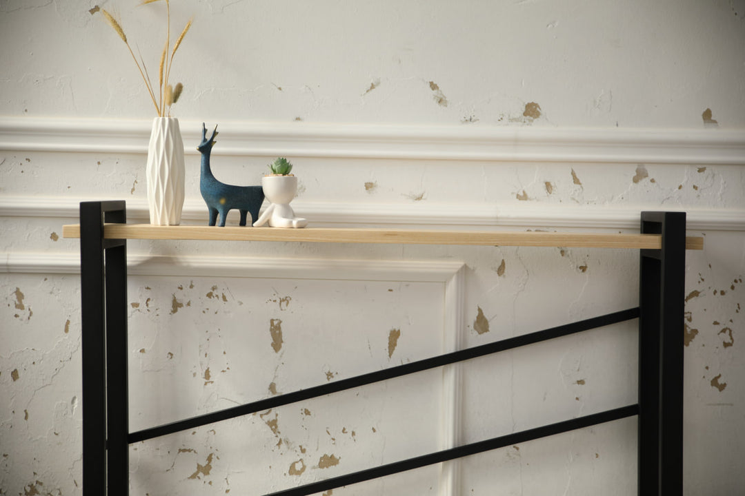 slim-wood-and-metal-console-table-placed-along-a-hallway-wall