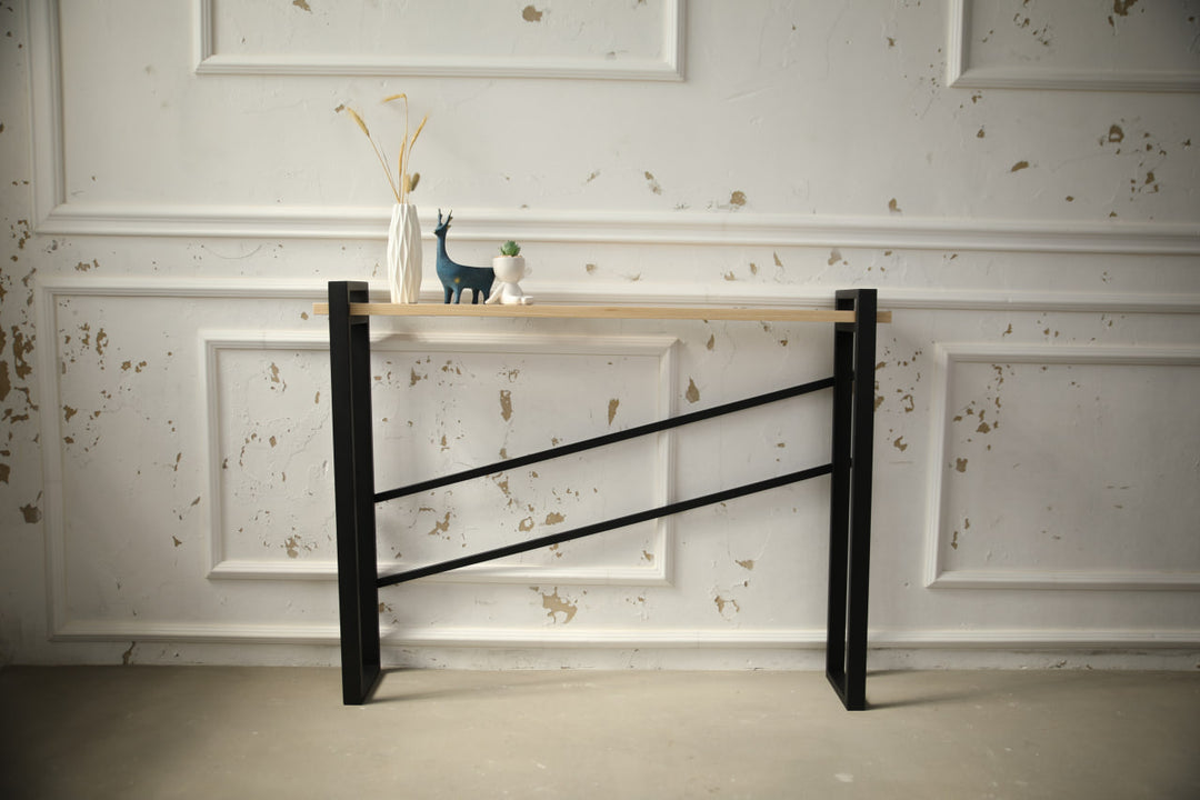 slim-wood-and-metal-console-table-placed-along-a-hallway-wall