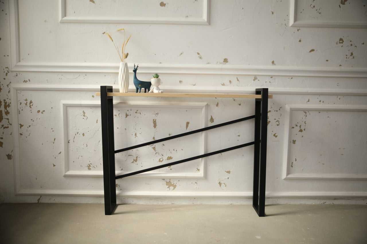 slim-wood-and-metal-console-table-placed-along-a-hallway-wall