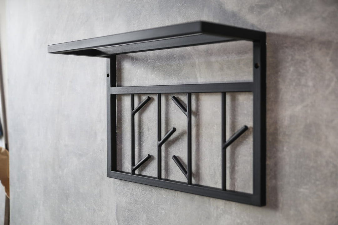 Modern-black-metal-wall-shelf-with-multiple-hooks