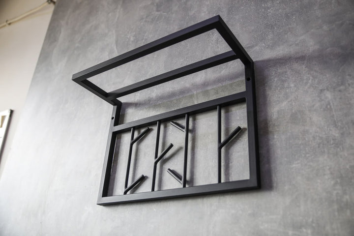 Modern-black-metal-wall-shelf-with-multiple-hooks