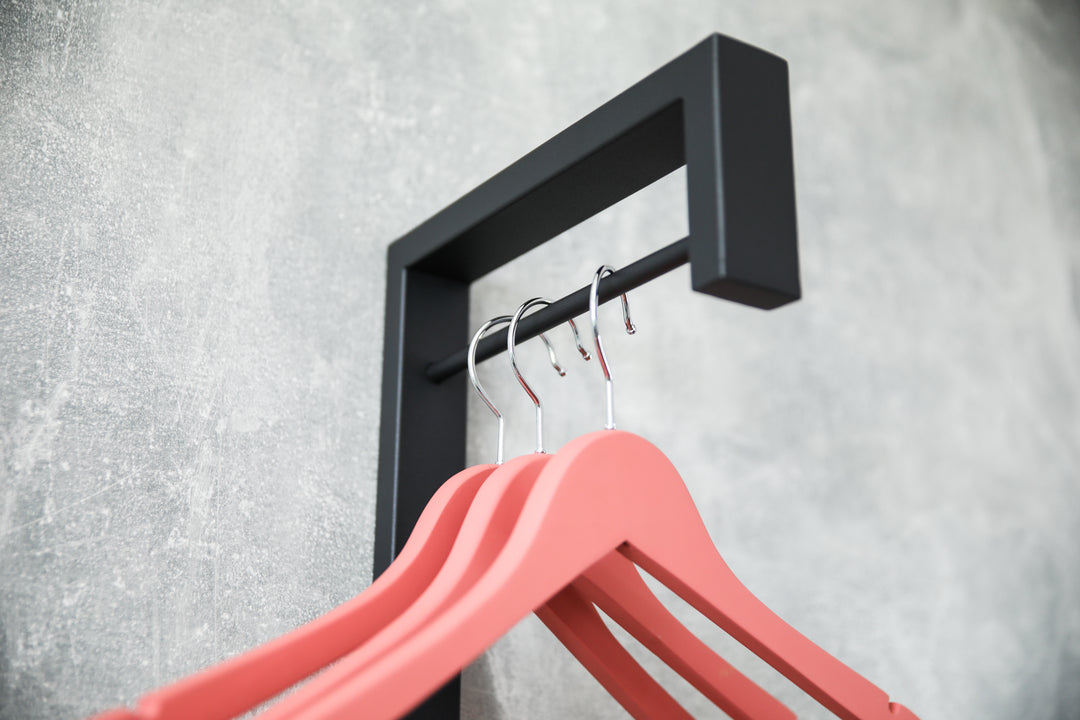 Sleek-metal-hanger-with-additional-pegs-for-extra-storage