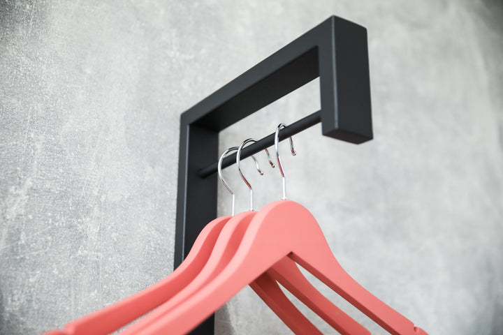 Sleek-metal-hanger-with-additional-pegs-for-extra-storage