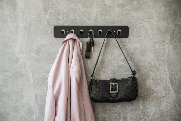 Minimalist-metal-key-hanger-with-sturdy-hooks-designed-for-keeping-keys-clothes