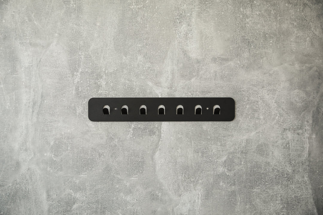 Minimalist-metal-key-hanger-with-sturdy-hooks-designed-for-keeping-keys-clothes