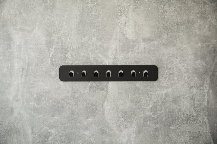Minimalist-metal-key-hanger-with-sturdy-hooks-designed-for-keeping-keys-clothes