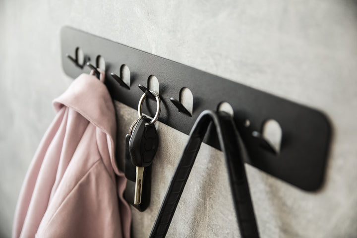 Minimalist-metal-key-hanger-with-sturdy-hooks-designed-for-keeping-keys-clothes