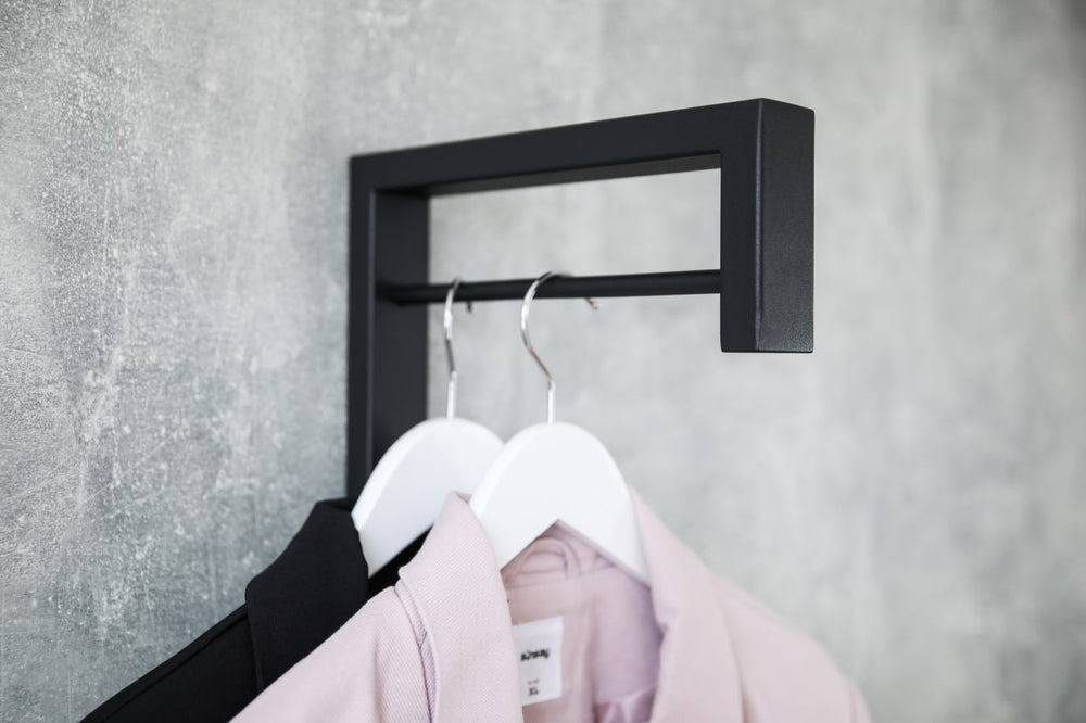 Contemporary-wall-mounted-clothes-hanger-with-a-practical-design