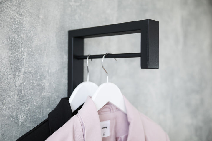 Contemporary-wall-mounted-clothes-hanger-with-a-practical-design
