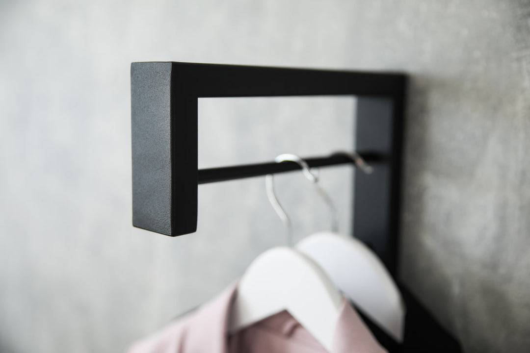 Contemporary-wall-mounted-clothes-hanger-with-a-practical-design