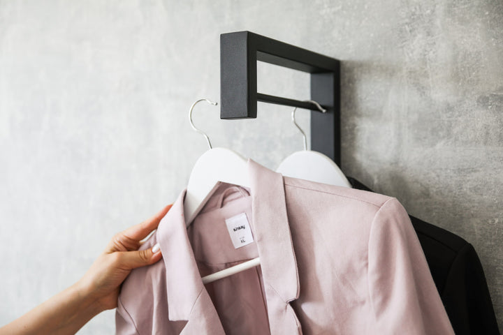 Contemporary-wall-mounted-clothes-hanger-with-a-practical-design