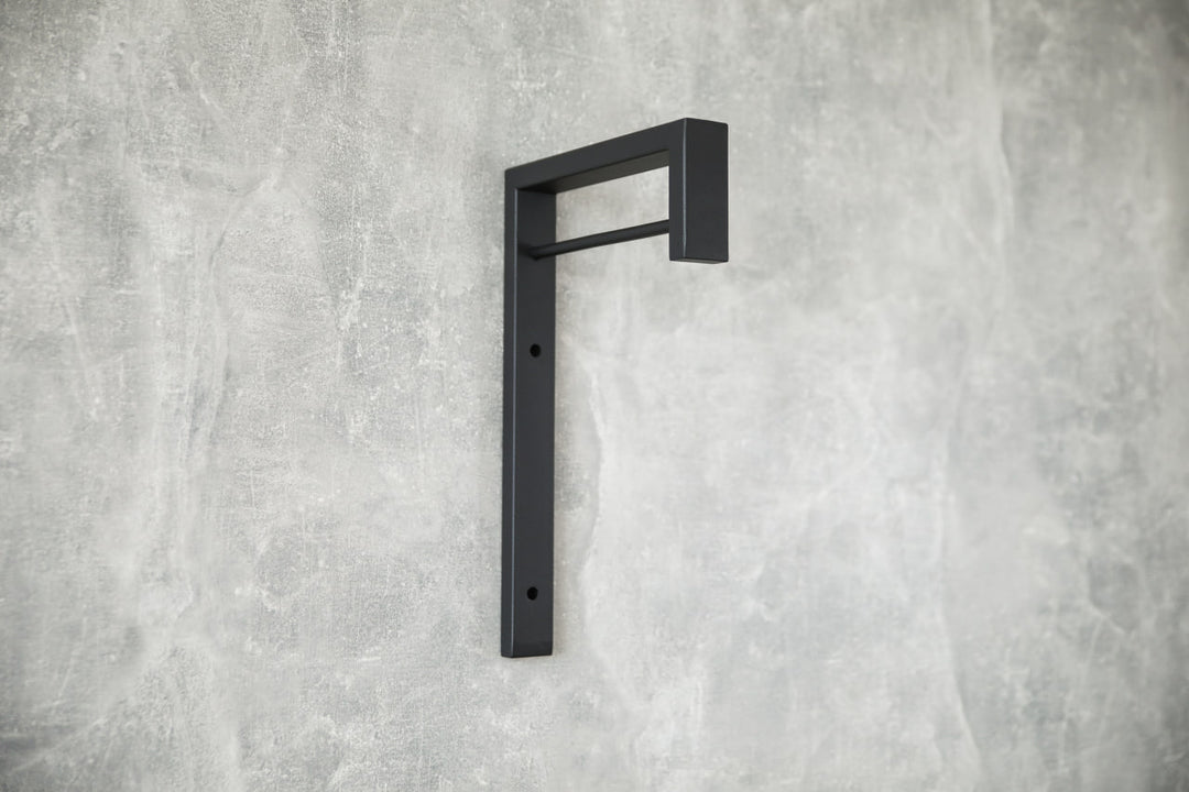 Contemporary-wall-mounted-clothes-hanger-with-a-practical-design
