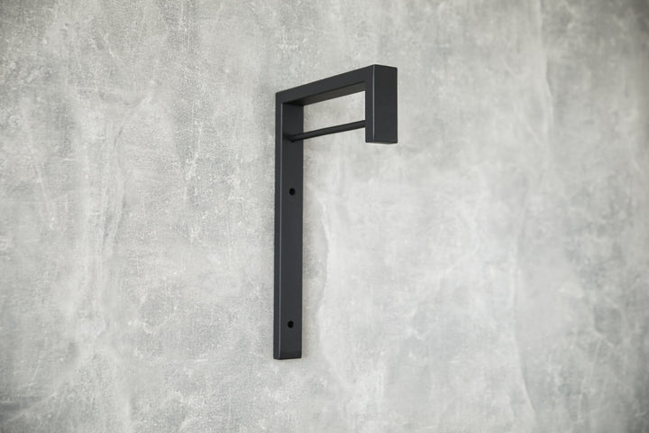 Contemporary-wall-mounted-clothes-hanger-with-a-practical-design
