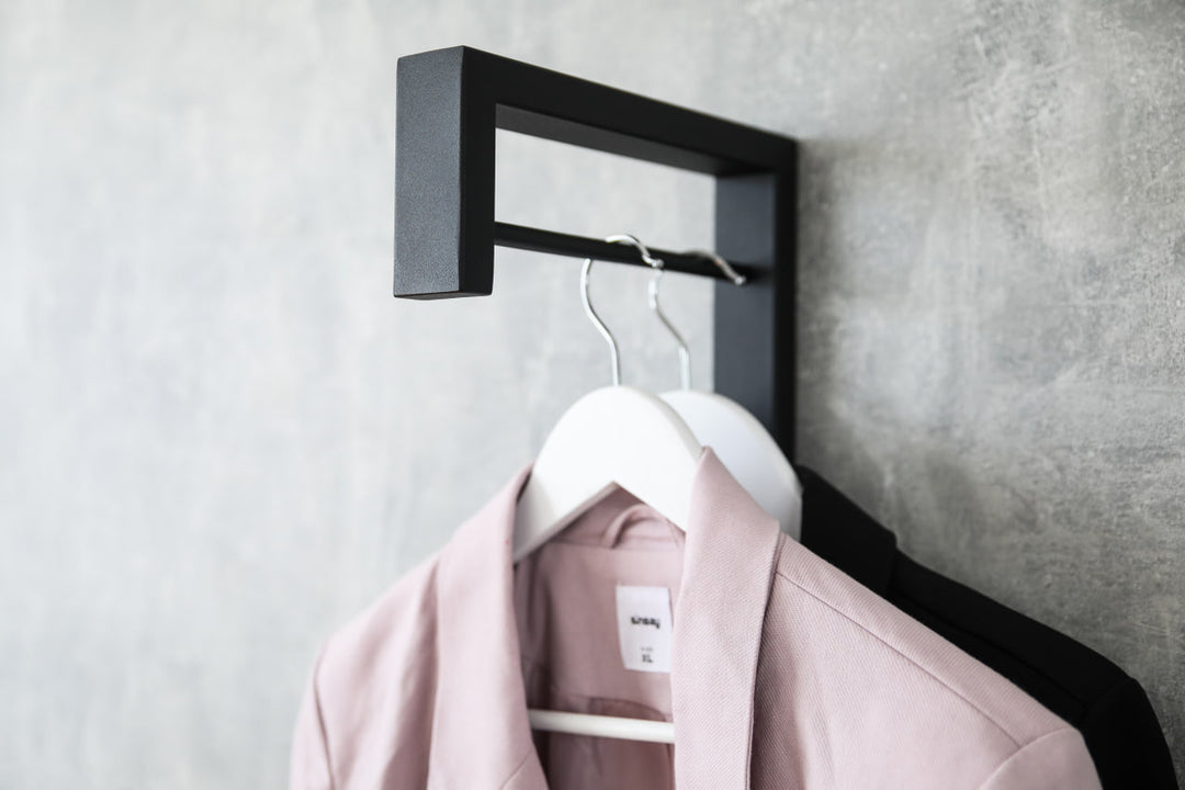 Contemporary-wall-mounted-clothes-hanger-with-a-practical-design