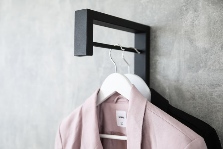 Contemporary-wall-mounted-clothes-hanger-with-a-practical-design
