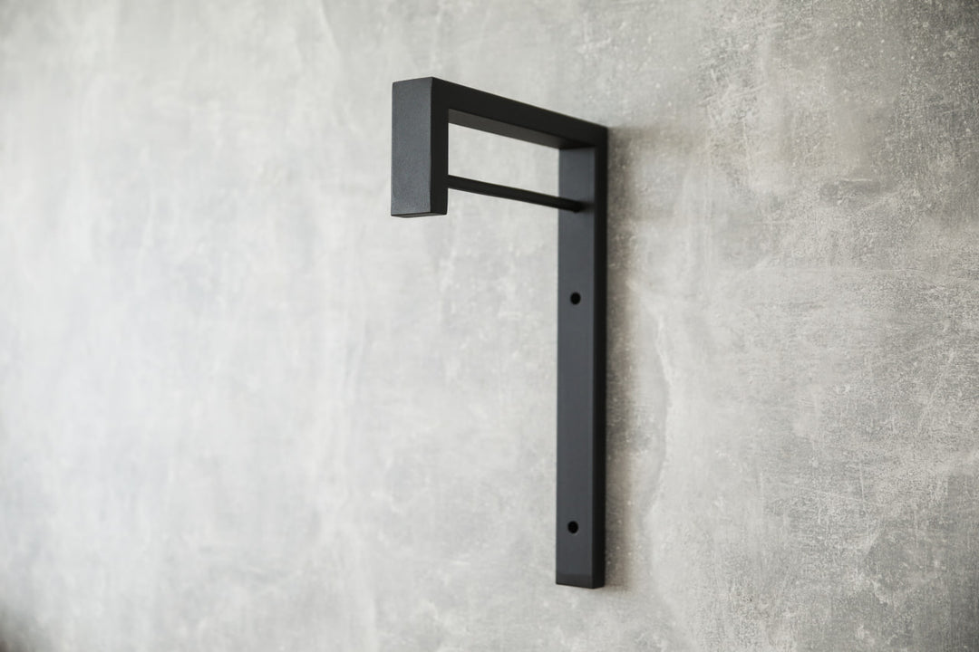 Contemporary-wall-mounted-clothes-hanger-with-a-practical-design