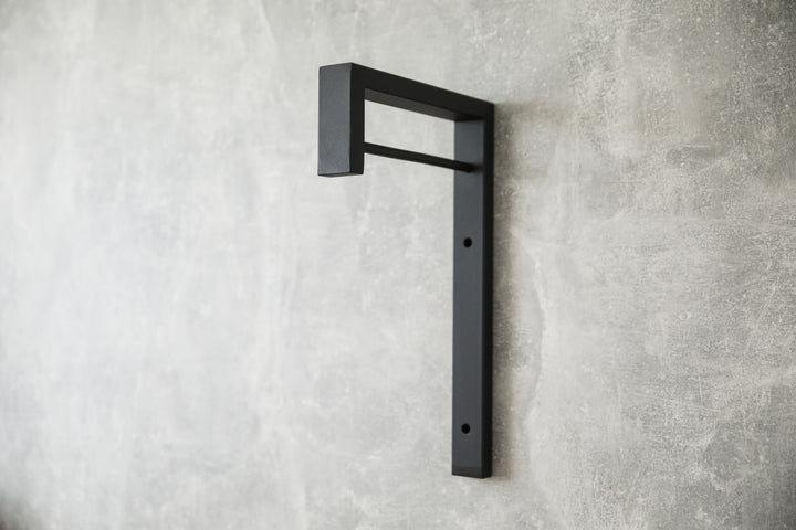 Contemporary-wall-mounted-clothes-hanger-with-a-practical-design