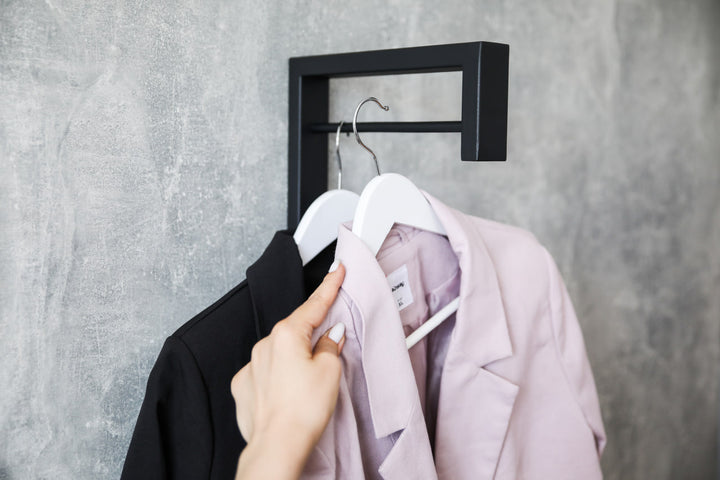 Contemporary-wall-mounted-clothes-hanger-with-a-practical-design