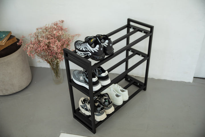 Metal-multi-tier-shoe-rack-with-sneakers-and-boots