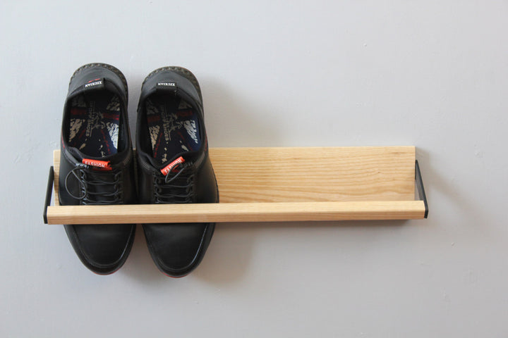 Sleek-and-practical-shoe-storage-solution-with-a-secure-holding-bar